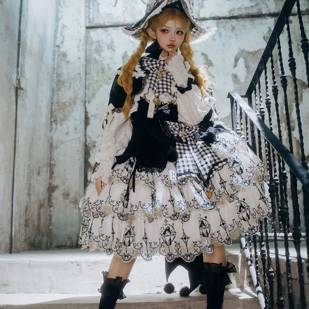 Full-length black and white Cat Witch outfit styled with a cape