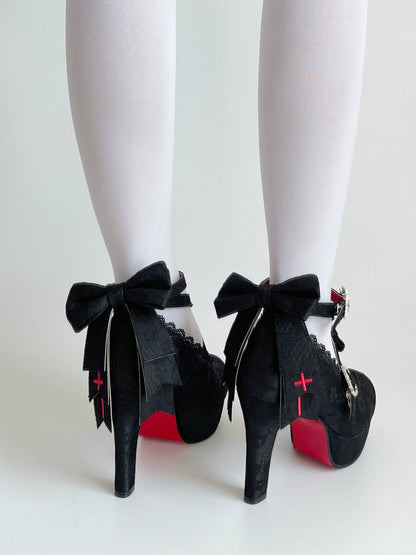Rear view of Holy Relic Cross black heels with bows and red cross decoration