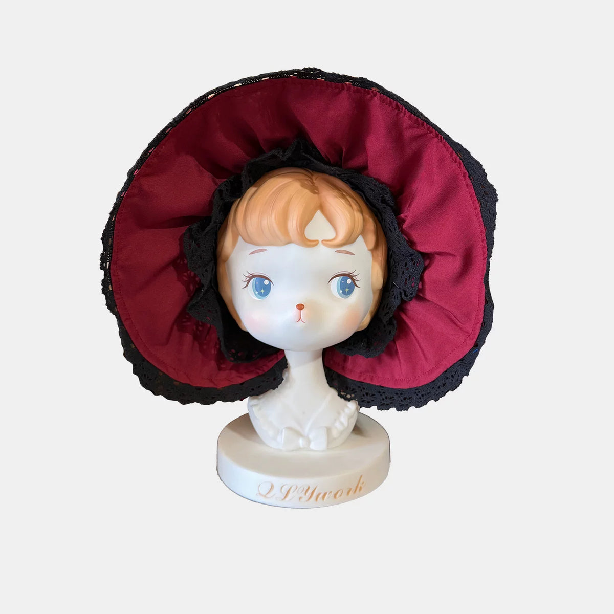 Burgundy Lace Bonnet shown separately on a display stand