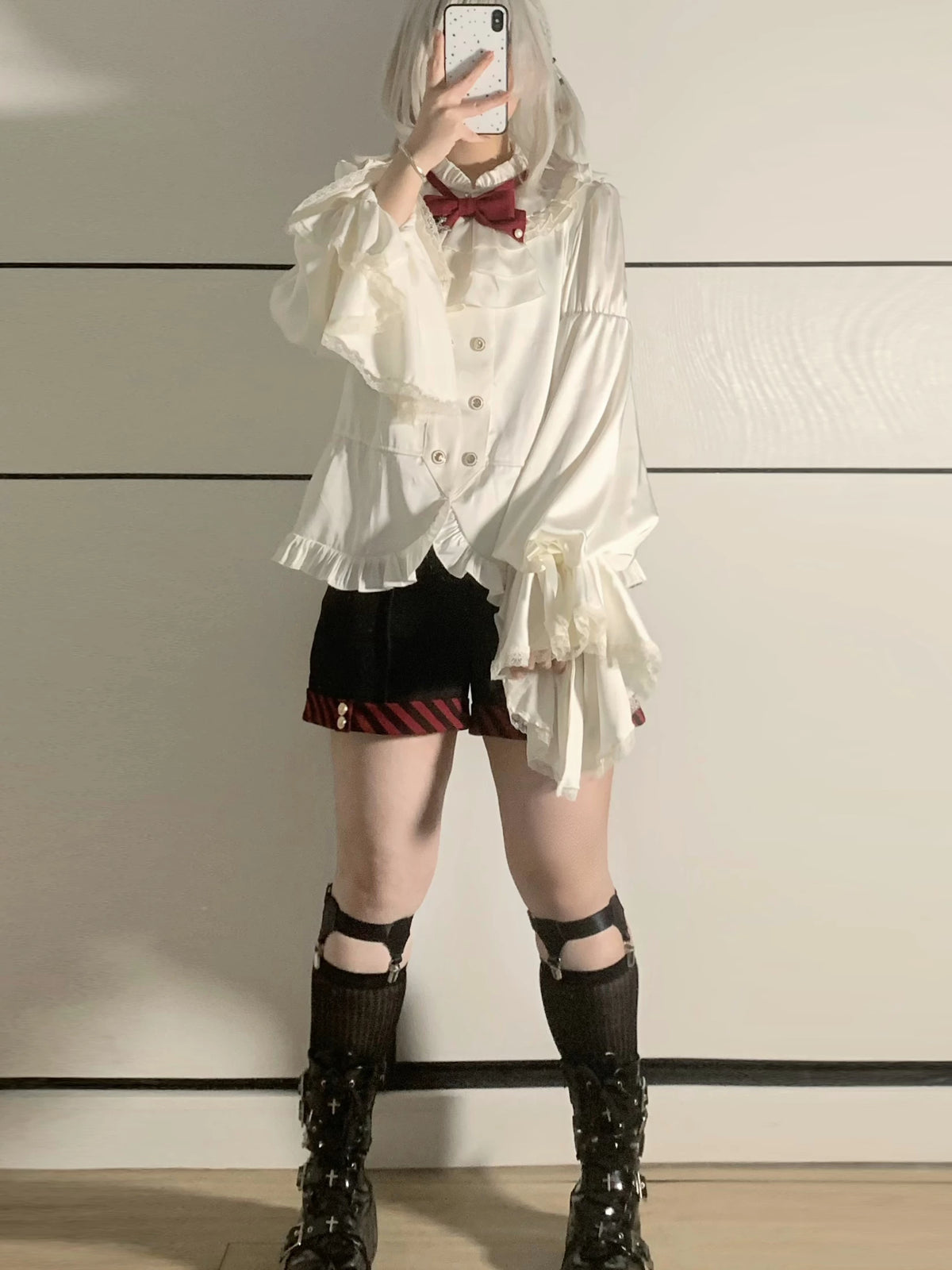 Ivory ruffled shirt and dark burgundy-trimmed shorts, styled view