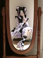 Mirror view of the black and purple Chanhua Xu JSK set