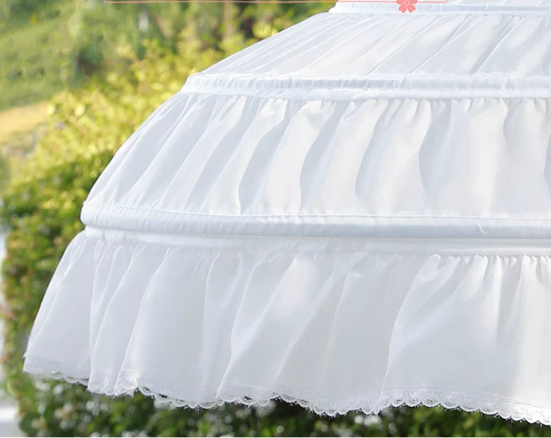 White pet bed with text overlay on a blurred green background