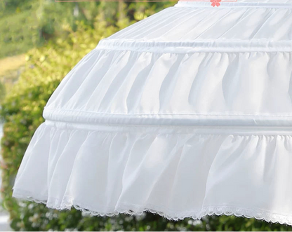 White pet bed with text overlay on a blurred green background