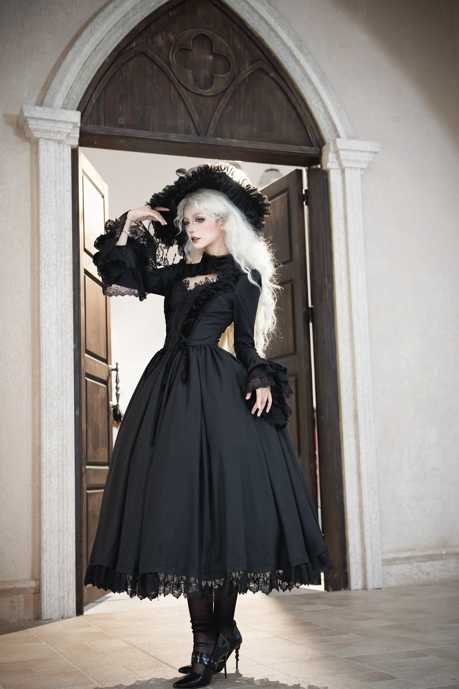 Full-length view of the black No Man's Land Rose OP dress