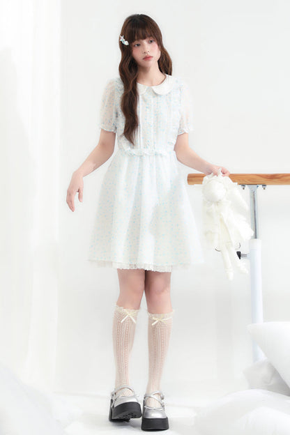 Puppe Ecosta Blumenkleid transparent