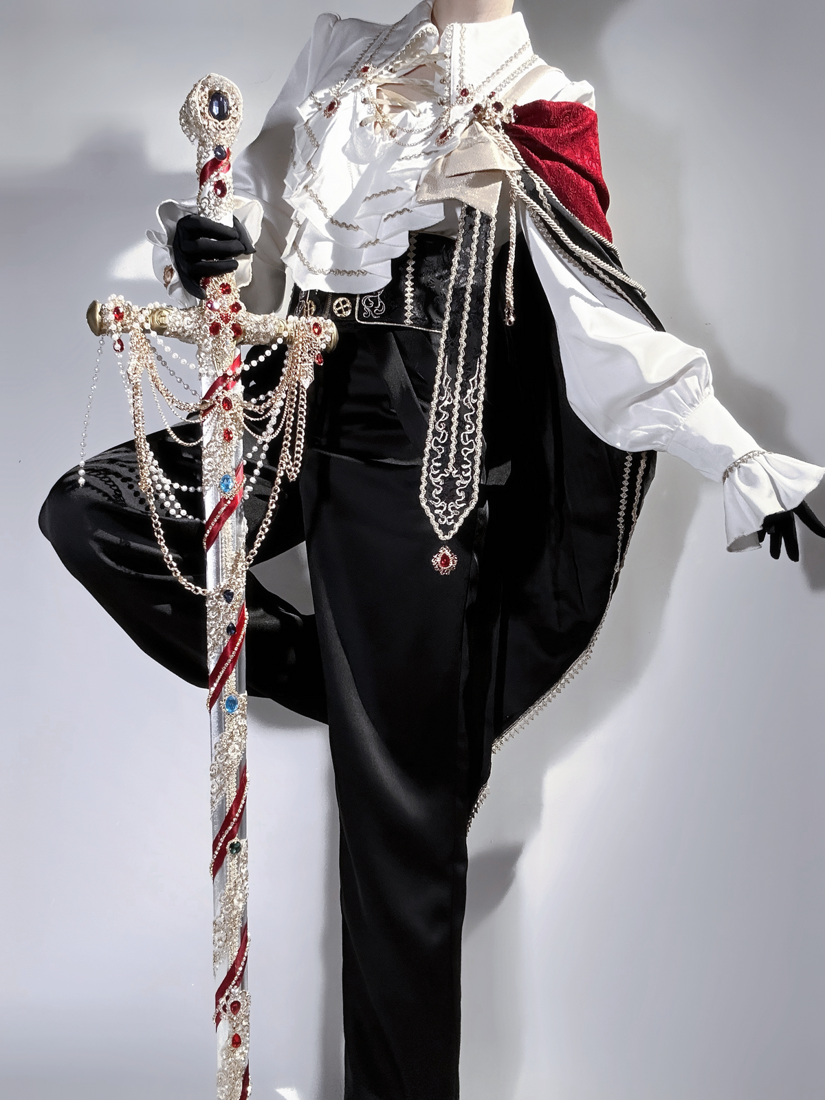Knight-inspired ouji Lolita outfit side view with burgundy shoulder cape