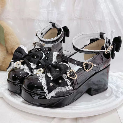 Patent black bow Mary Jane shoes on display
