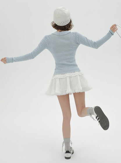 Blauer Anzug mit Strickkragen und hellen Streifen