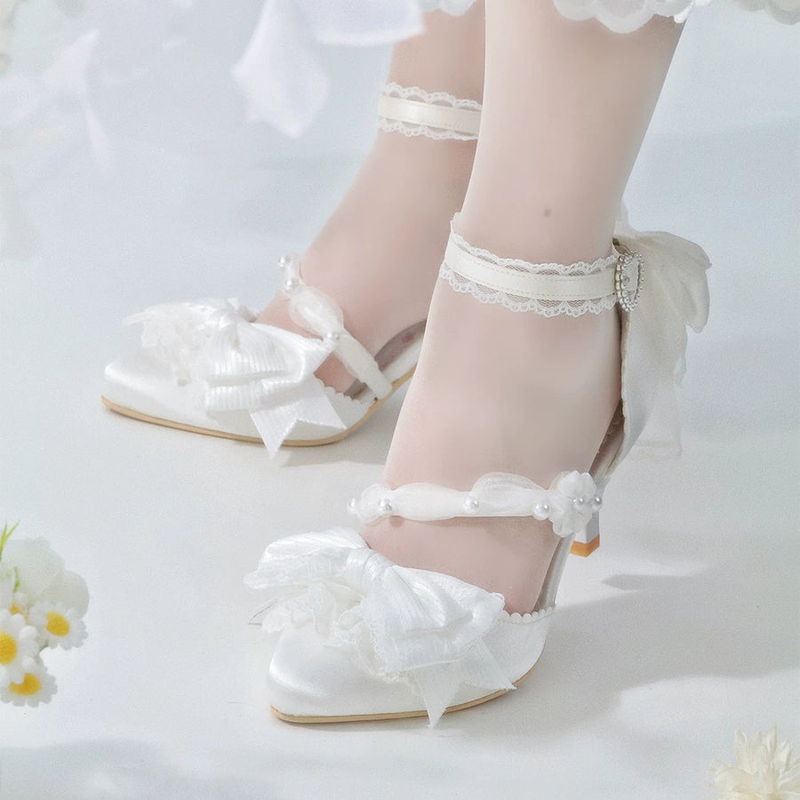 White Spring Sakura pointed-toe heels with ankle straps