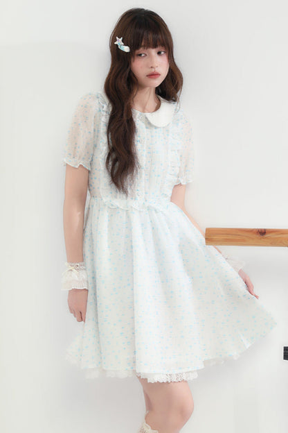 Puppe Ecosta Blumenkleid transparent