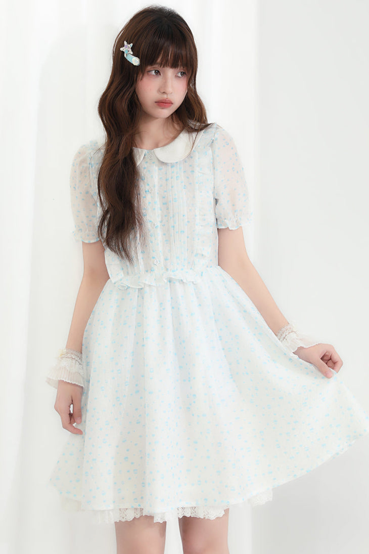 Puppe Ecosta Blumenkleid transparent