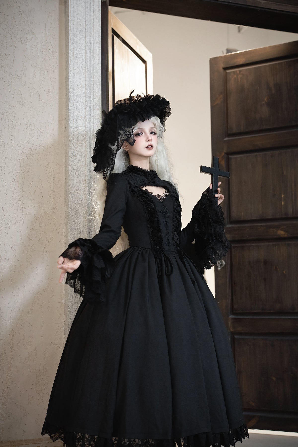 Angled view of the dress with flared lace cuffs