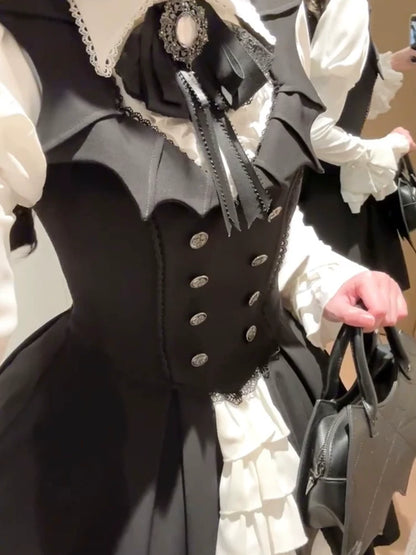 Close-up of bat-wing neckline and buttoned bodice