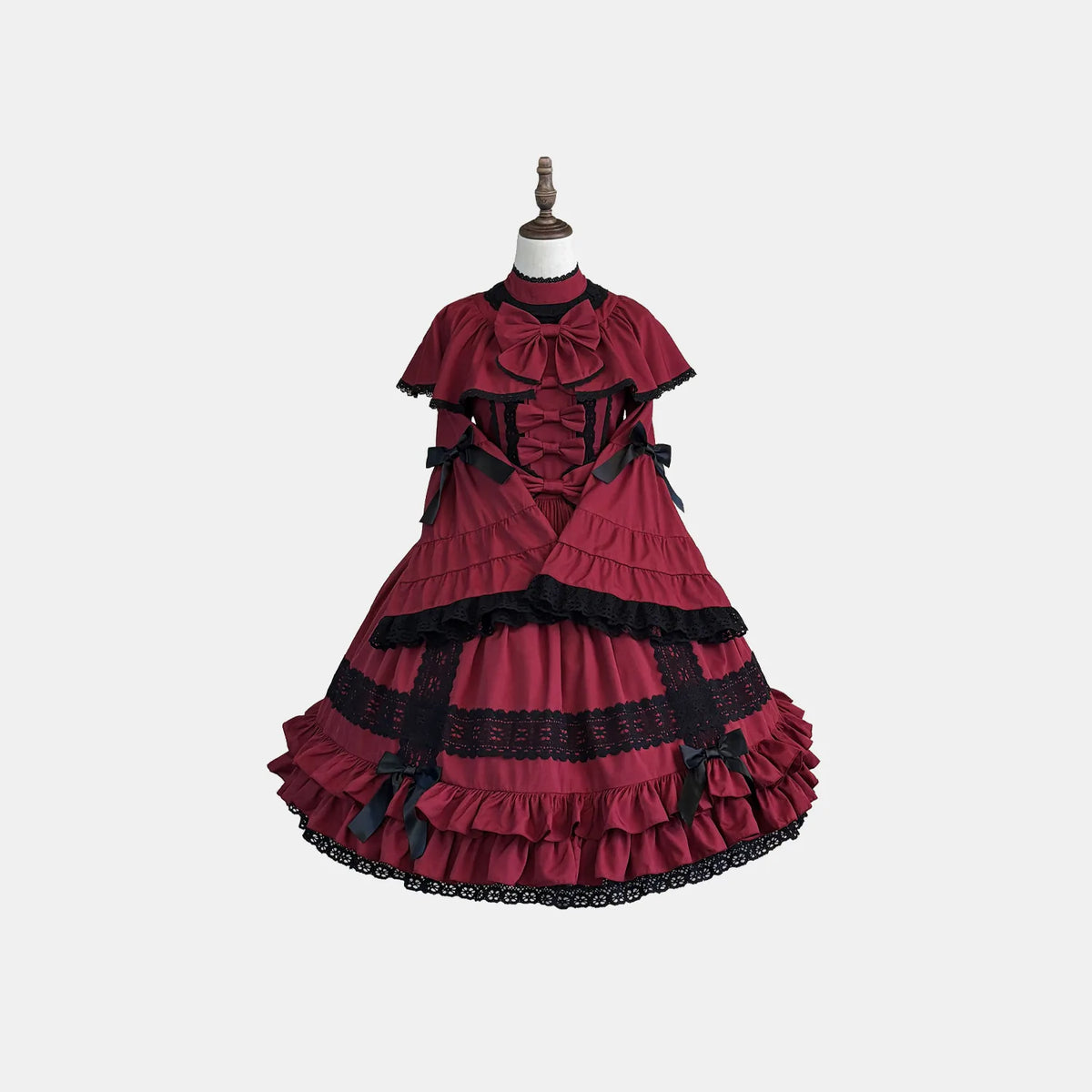 Burgundy OP Dress shown separately on a display stand