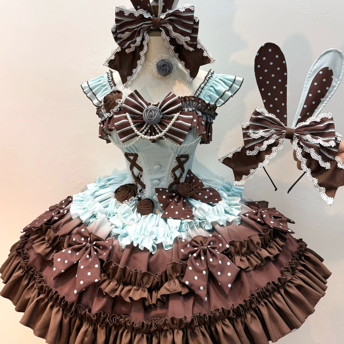 Mint chocolate ruffle dress with floral bows and bunny-ear headpiece