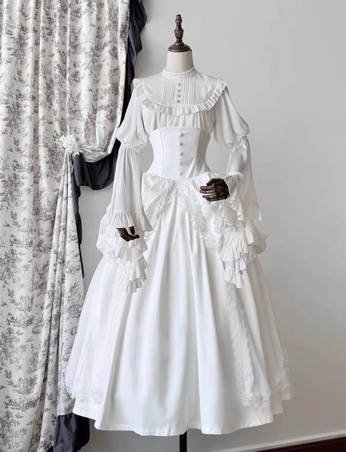 White blouse and skirt coordinate on mannequin
