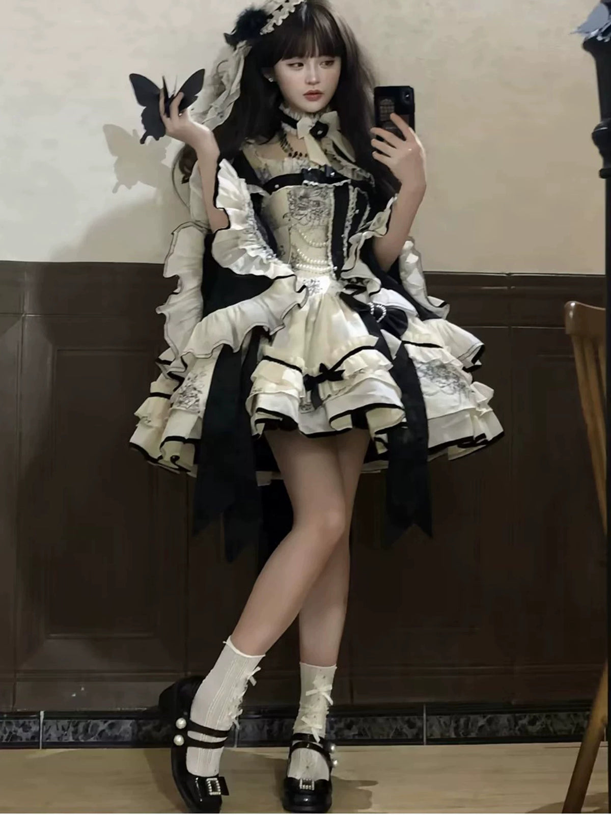 Short layered Lolita dress styled on model in mirror view