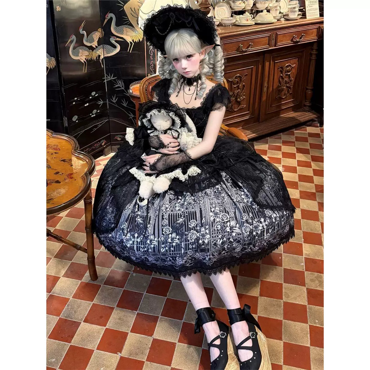 Black Gothic Lolita JSK dress seated styling view