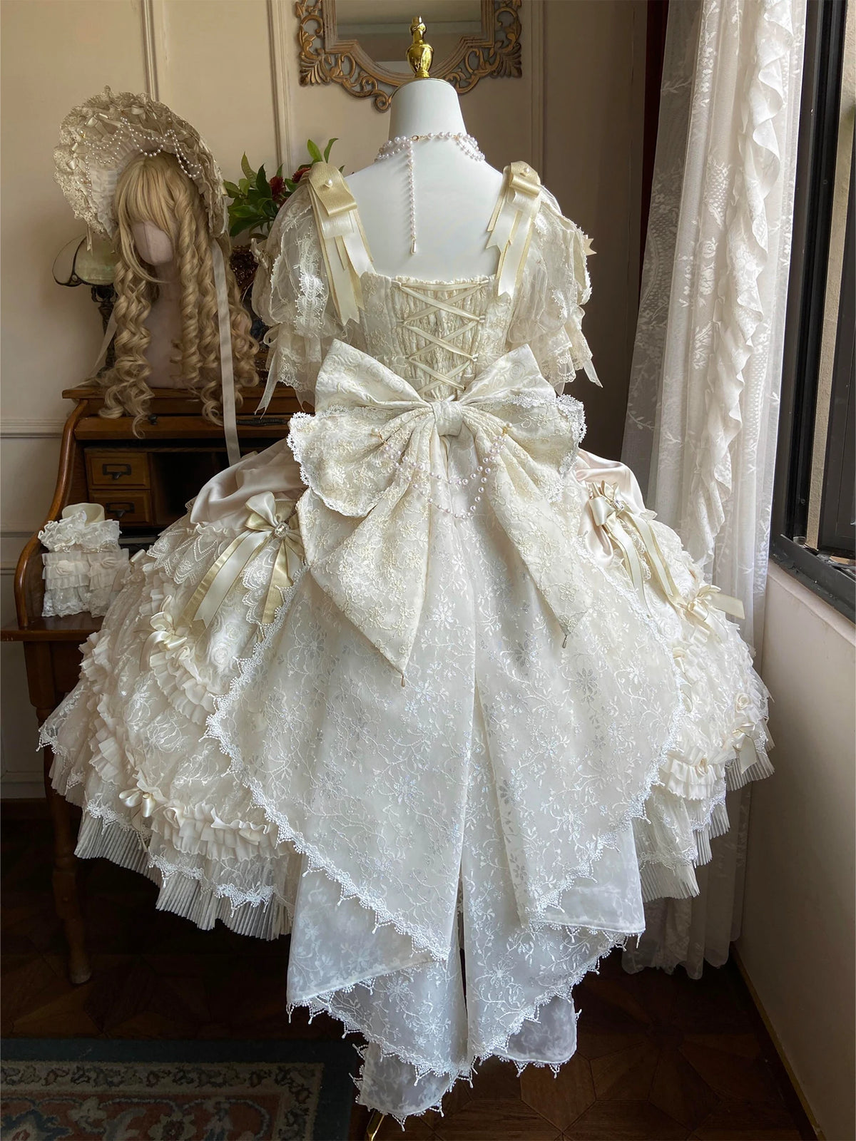 Rear view of the ivory dress styled with a train
