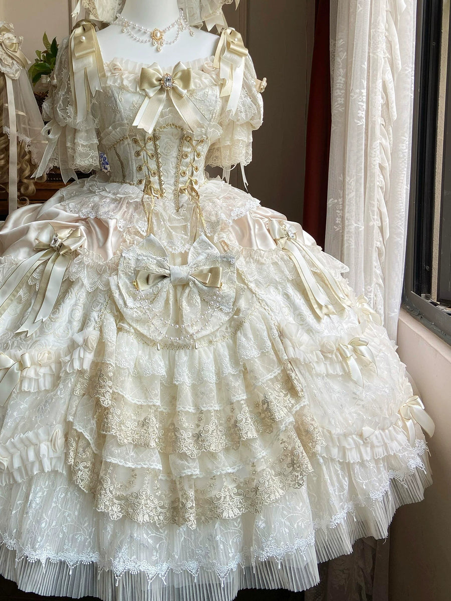 Layered lace skirt and gold details on the Gilded Dream dress