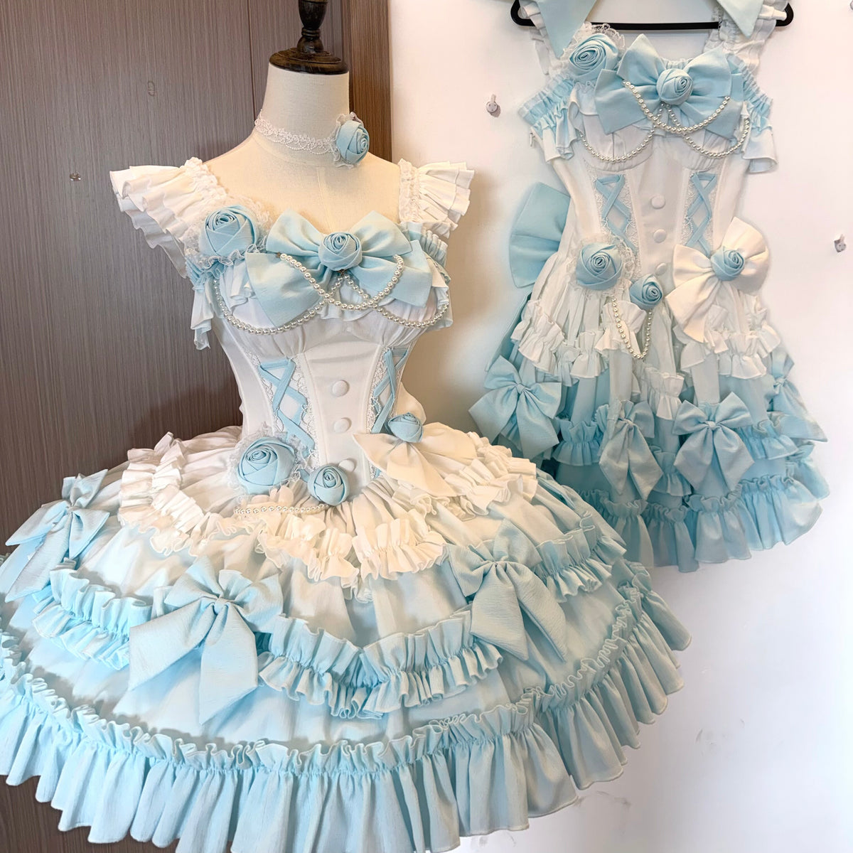 Pale blue and ivory Babaluya layered ruffle dress displayed on mannequins