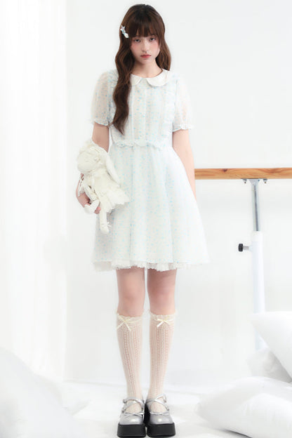 Puppe Ecosta Blumenkleid transparent