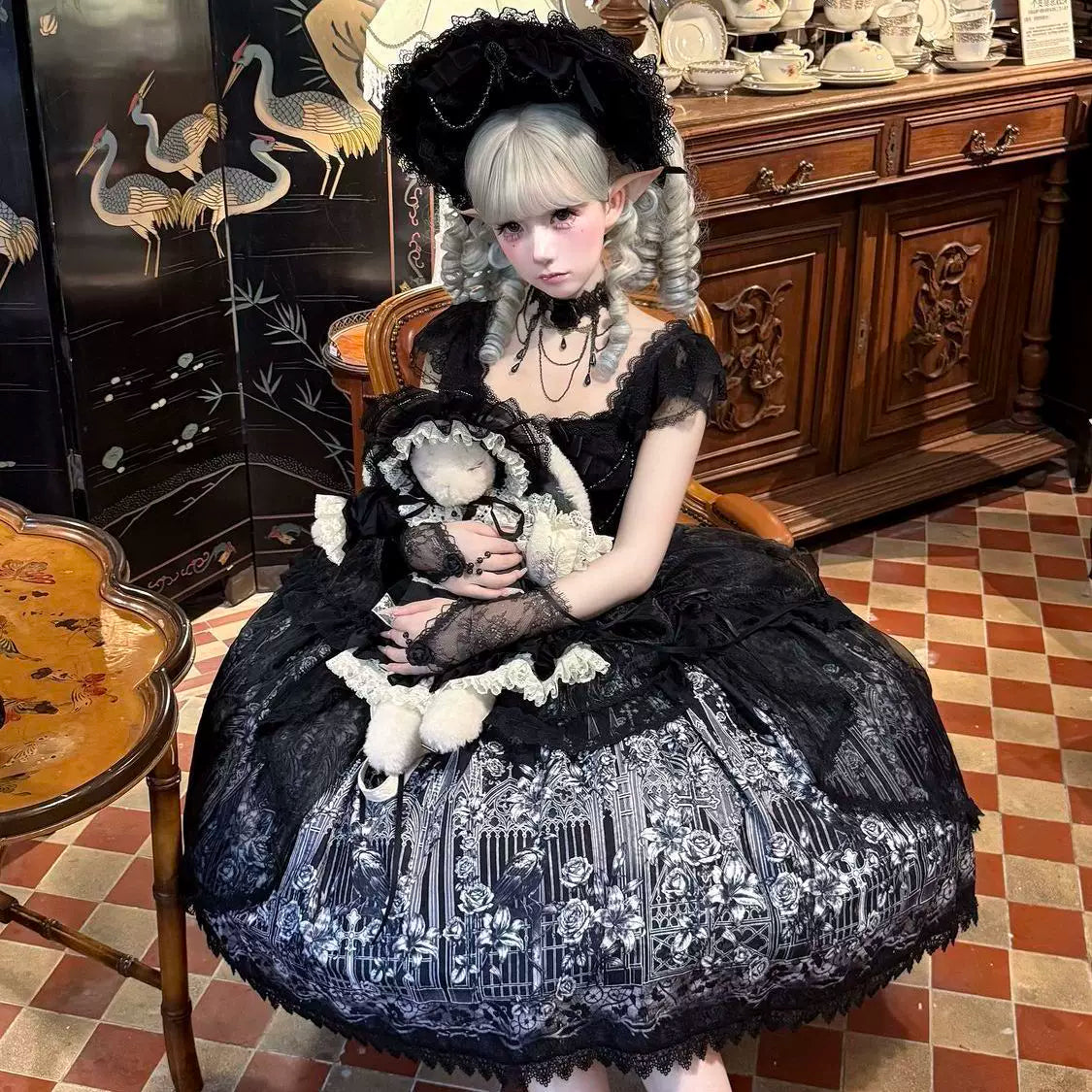 Black Gothic Lolita JSK dress styling on seated model