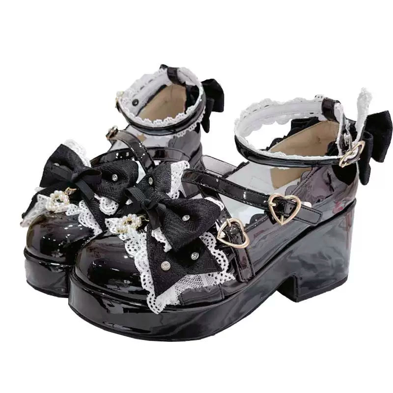 Patent black platform Mary Jane shoes with ankle strap and heart accents