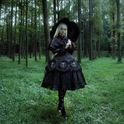 Black Night Cross Gothic Lolita outfit styled outdoors
