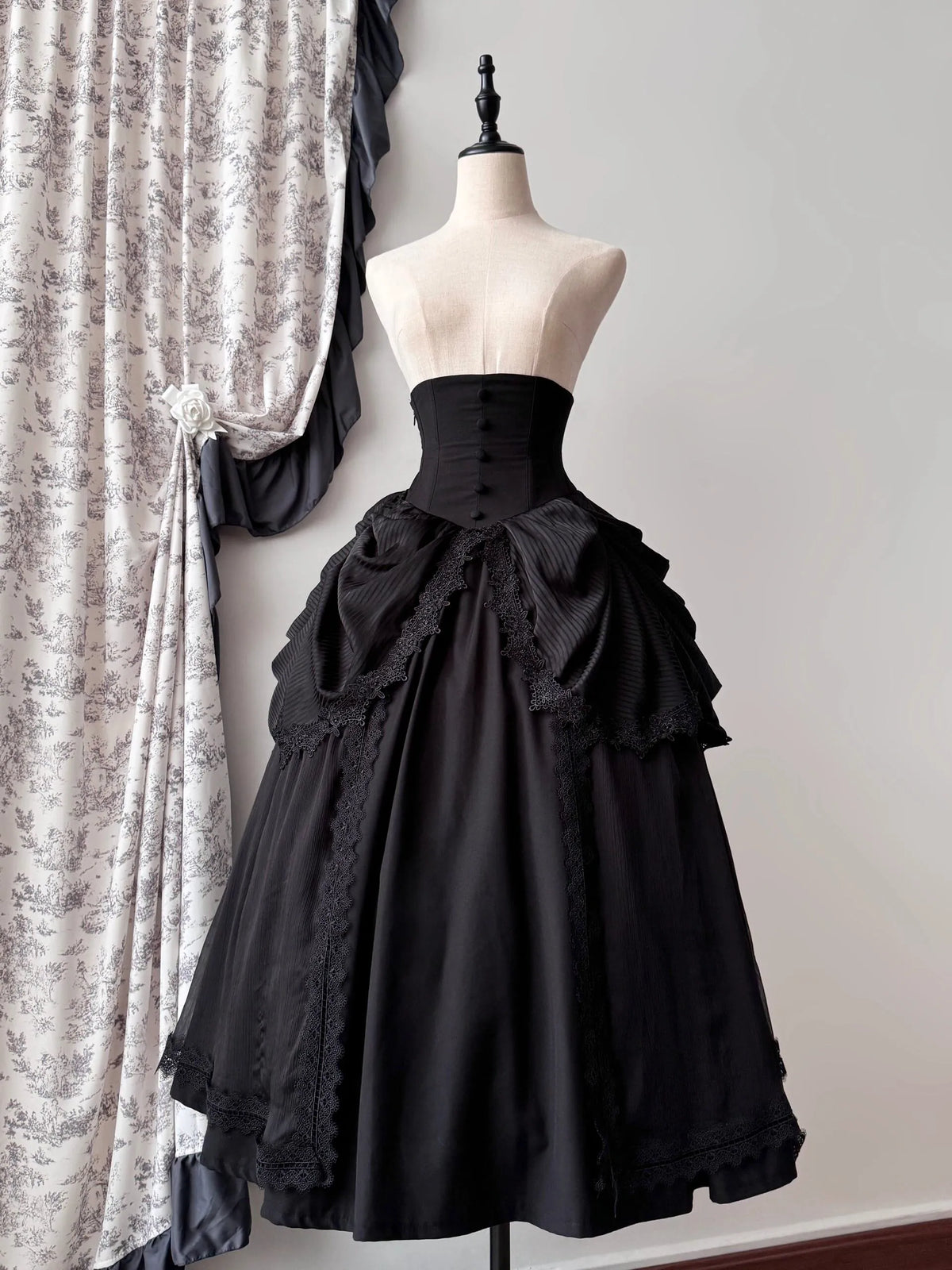 Black high-waist skirt with draped ruffles, front view
