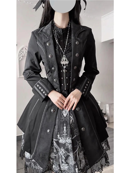 Pointed collar, decorative buttons and cuff detailing on a black Gothic coat