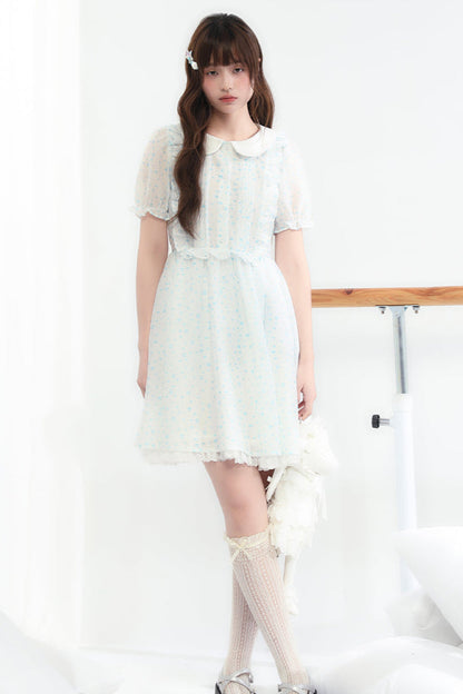 Puppe Ecosta Blumenkleid transparent