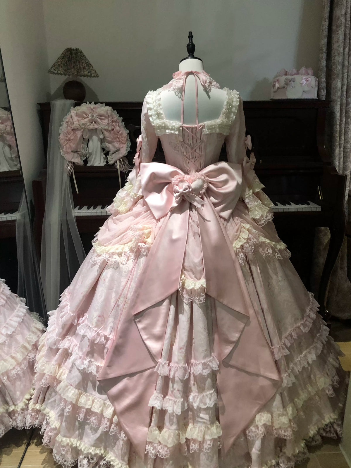 Back view of pink Rococo Lolita gown with oversized satin bow