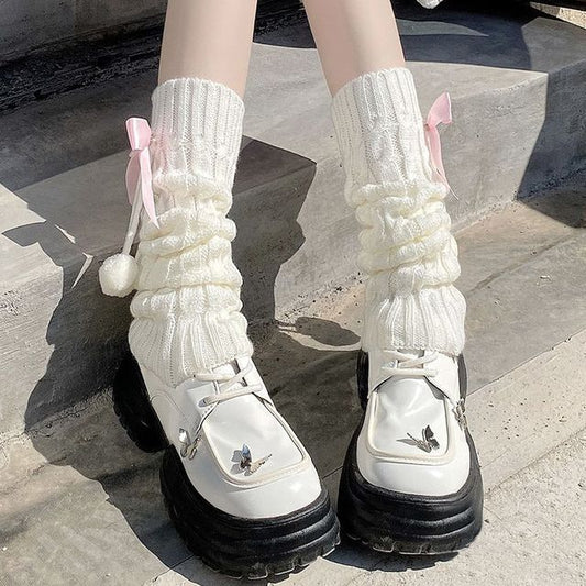 Beinwärmer mit Schleife und Zopfmuster