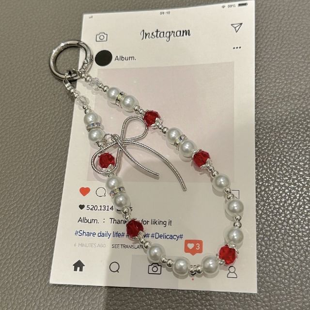 Schleifenpad mit Kunstperlen und Handy-Lanyard