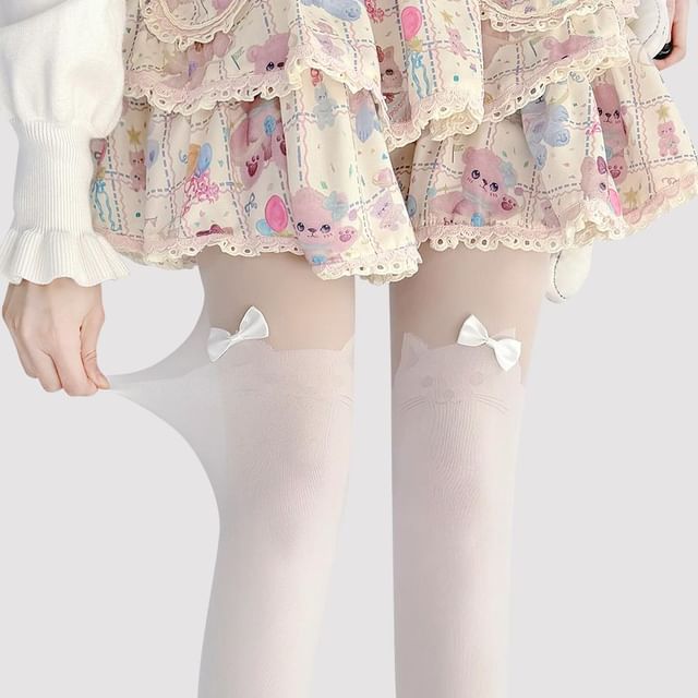 Transparente Strumpfhose mit Katzenmuster und Schleife