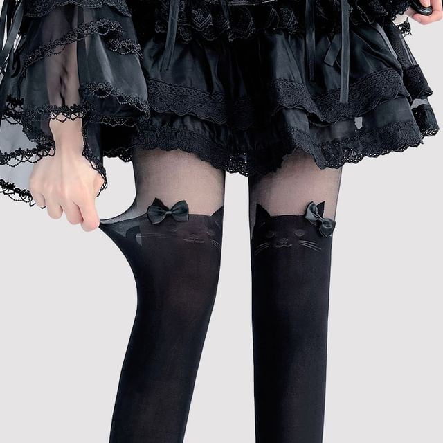 Transparente Strumpfhose mit Katzenmuster und Schleife