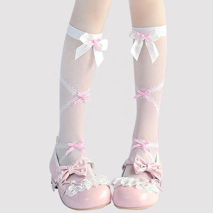 Hohe, transparente Kniestrümpfe mit Schleife