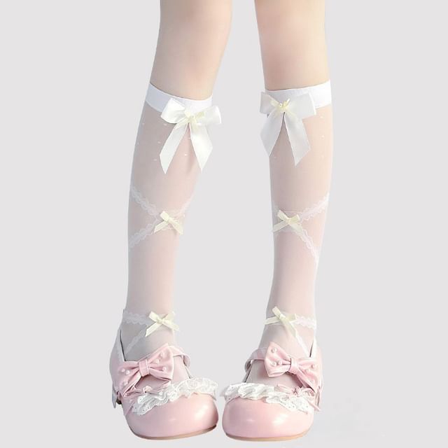 Hohe, transparente Kniestrümpfe mit Schleife