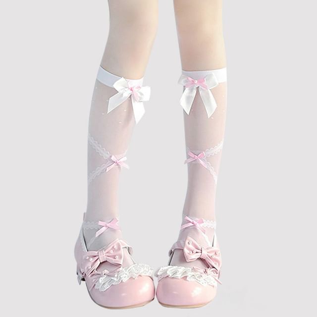 Hohe, transparente Kniestrümpfe mit Schleife