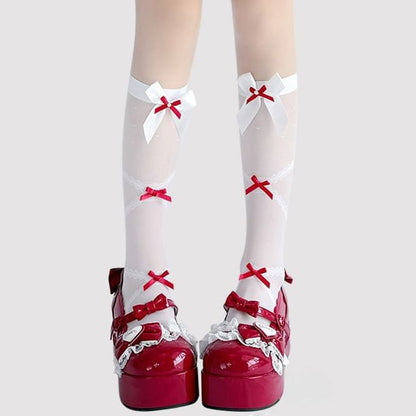 Hohe, transparente Kniestrümpfe mit Schleife