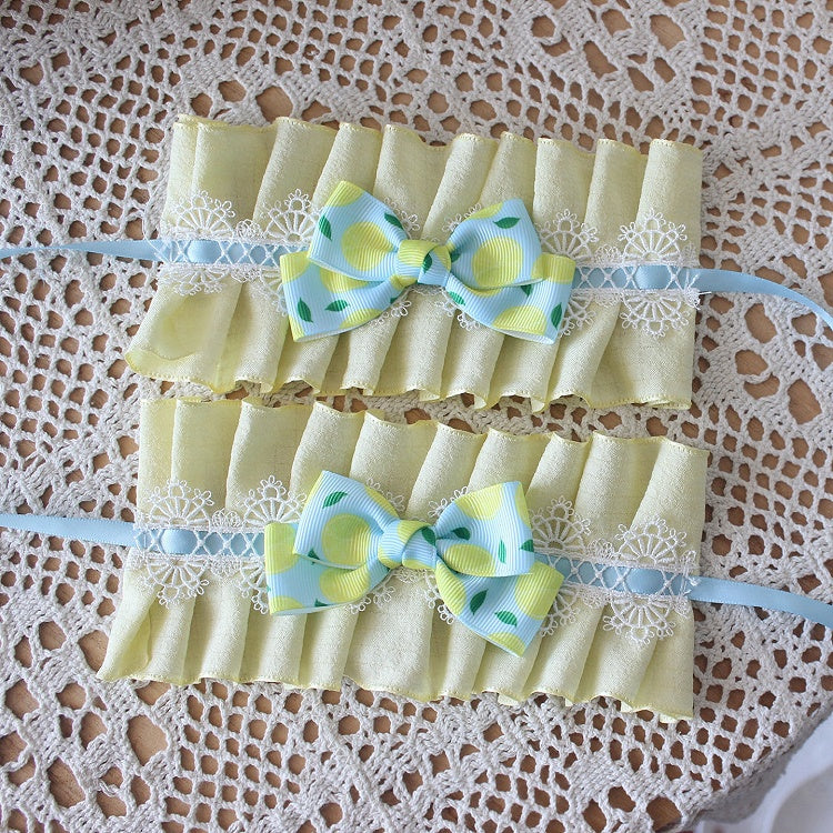 Gelb mit Zitronenmanschetten, Schleife, blauer Druck, Handgelenk, Rüschen