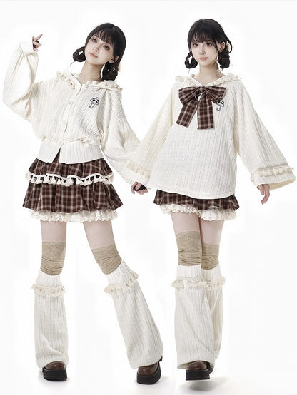 ブラウンのチェック柄ティアードスコート、フリル袖口、フリンジトリム