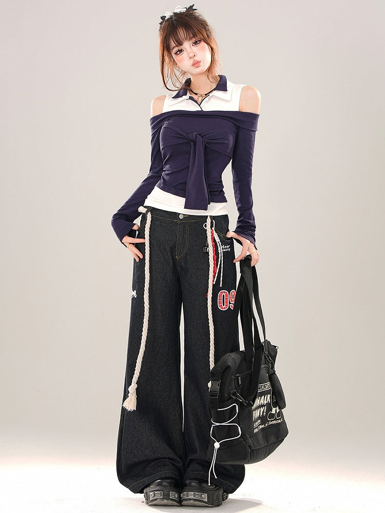 Marineblaues Patchwork-Top mit Krawattenakzent und Cut-Out-Schulter