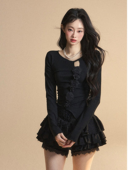 Schwarzes Top mit rundem, glamourösem Detail und gestricktem Halsausschnitt, Blumenverzierung und Cut-Outs