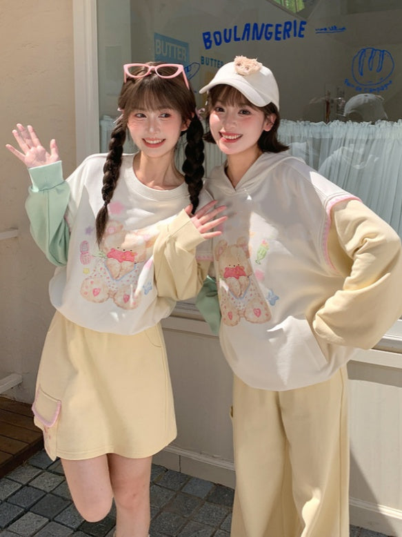 グリーンテディベアプリントドローストリングスウェットシャツ裾イエローデザインカラーブロック秋と