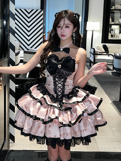 ピンクの蝶結び生地のティアードパフィースカート、ホルターネック、バースデーコルセットドレス