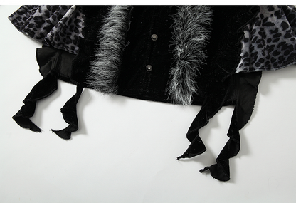 Schwarzes und graues Oberteil mit Leopardenmuster und zotteligem Besatz