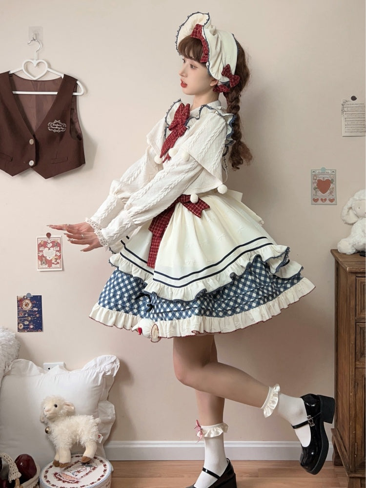 Cremefarbene Haube mit roter Schleife