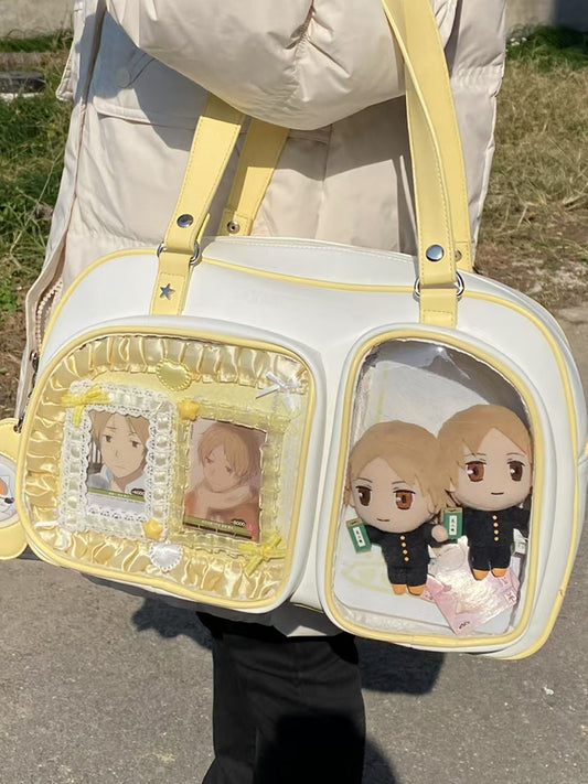 Cremegelbe Ita-Schultertasche in Brotform mit Kontrastbesatz